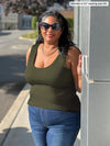 Miik model Michelle (5'2", xxlarge) smiling wearing Miik's Amina reversible tank shelf bra in olive green with jeans and sunglasses 
#color_olive 