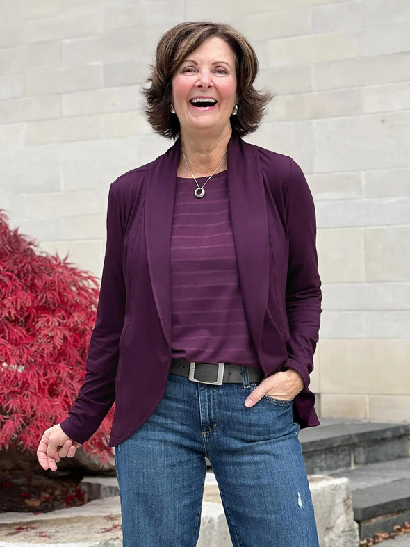 Miik founder Donna wearing the Anne soft cardi blazer in port over a matching tank top with jeans.