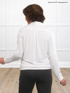 Miik founder Donna (5’6”, small) standing with her back towards the camera showing the back of Miik's Arianna collared shirt in white #color_white 