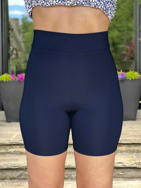 A close up image of Miik's Chalha high waisted mid thigh biker short in navy