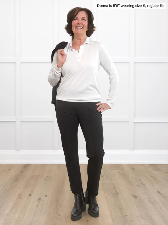 Miik founder Donna (5'6", small) smiling wearing Miik's Christal pintuck pull on ankle pant in black regular fit with a collared shirt in white 
#color_black