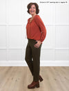 Miik founder Donna (5'6", small) smiling and looking away wearing Miik's Christal pintuck pull on ankle pant in olive along with a paprika melange blouse 
#color_olive 