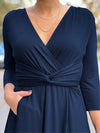 A front close up shot of Miik's Claudine tie waist midi dress in navy #color_navy