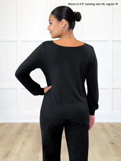 Miik model Meron (5’3”, xsmall) standing with her back towards the camera showing the back of Miik&