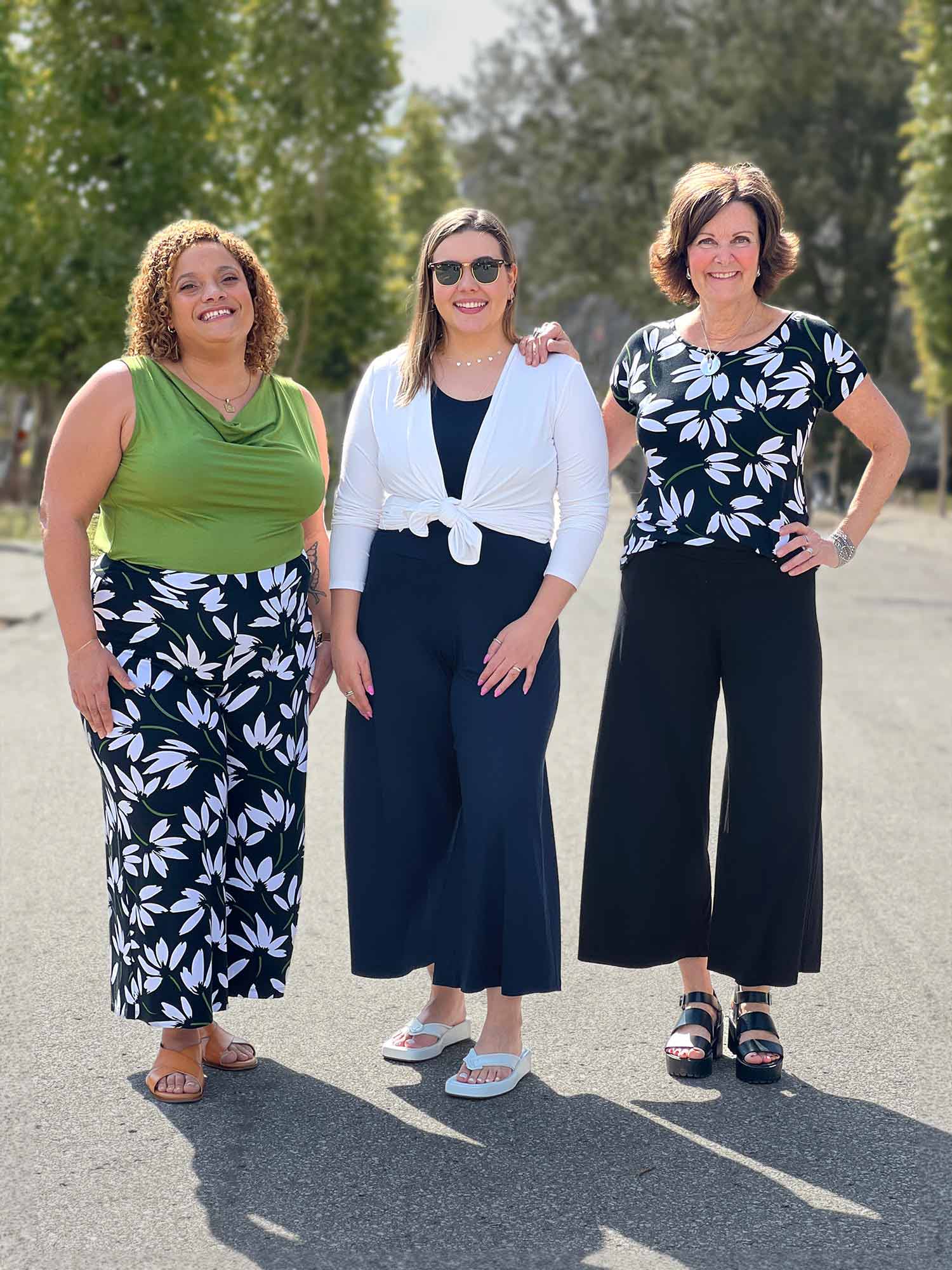 Miik models Carley and Christal along with founder Donna standing next to each other smiling showing different ways of styling the Miik&