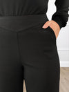 A close up shot of the waistband of Miik's Kiva high waisted wide leg ponte pant with pockets in black #color_black