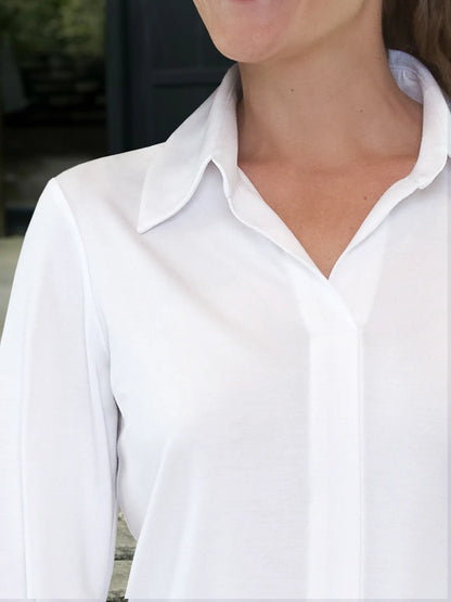 A close up detail shot of the collared neckline of the Miik&