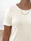 A close up image of the neckline Miik's Madeline reversible neckline ribbed half sleeve t-shirt in natural 
#color_natural-ribbed