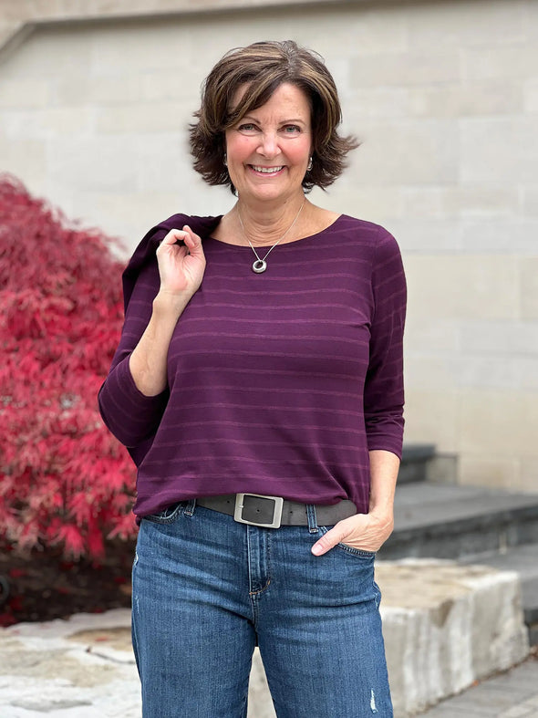 Miik founder Donna (5'6", small) smiling wearing Miik's Mahala boatneck 3/4 sleeve top in porto stripe with jeans #color_porto-stripe