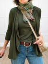 A close up image of  Miik's Rory waterfall cardigan in olive with a matching colour tank
#color_olive