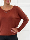 An close up shot of the neckline of the new Miik's Rosalie long sleeve dolman sweater in chestunut
#color_chestnut