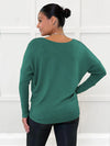 Miik model Meron (size XS, 5'3") showing the  back of the Rosalie dolman sweater in evergreen with leggings. #color_evergreen