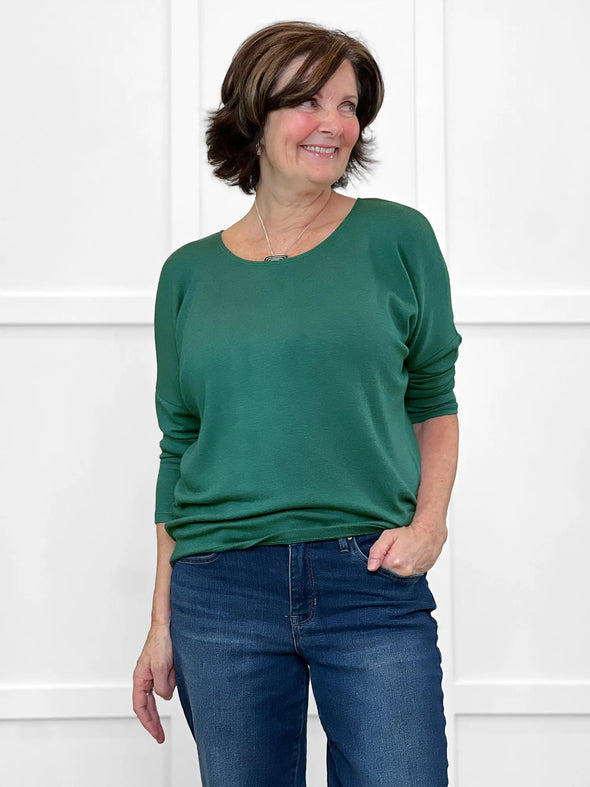 Miik founder Donna (size S, 5'6") wearing the Rosalie dolman sweater in evergreen with jeans. #color_evergreen