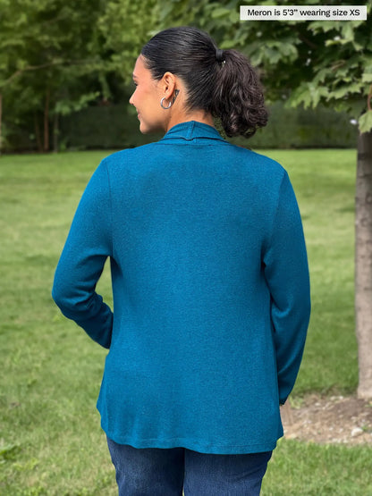 Miik model Meron (5’3”, xsmall) standing with her back towards the camera showing the back of Miik&