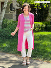 Miik founder Donna (5'6" small) smiling wearing Miik's Shandra reversible tank top in grey garden stripe with a long duster in pink and white jeans
