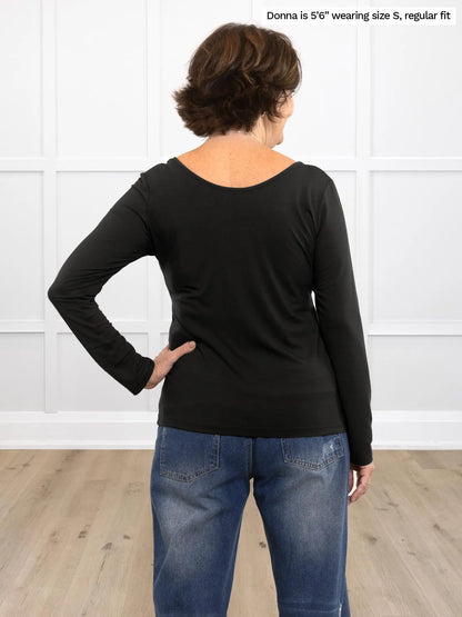 Miik founder Donna (size S) showing the back of the Shannon reversible long sleeve tee in black. 