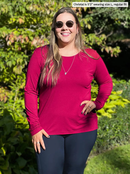 Miik model Christal (size L) wearing the Shannon reversible long sleeve tee in bordeaux red with navy pants. 