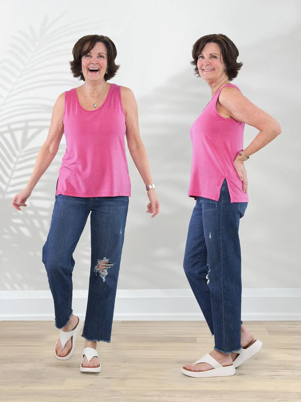 Miik founder Donna (5'6", small) smiling wearing Miik's Shyanne reversible neckline side slit tank in pretty in pink with jeans and white sandals #color_pretty-in-pink