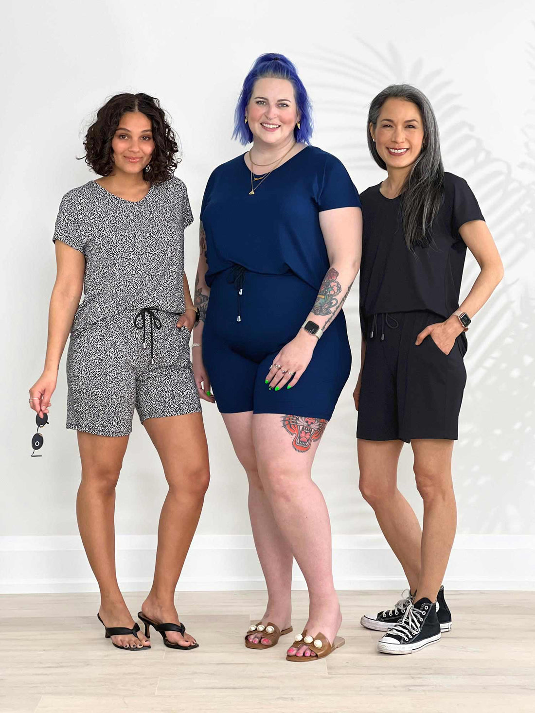 Miik models Meron, Kaitlin and Lisa all smiling and wearing the same romper: the Miik&