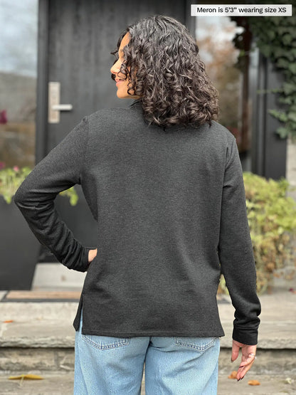 Miik model Meron (5’3”, xsmall) standing with her back towards the camera showing the back of Miik&