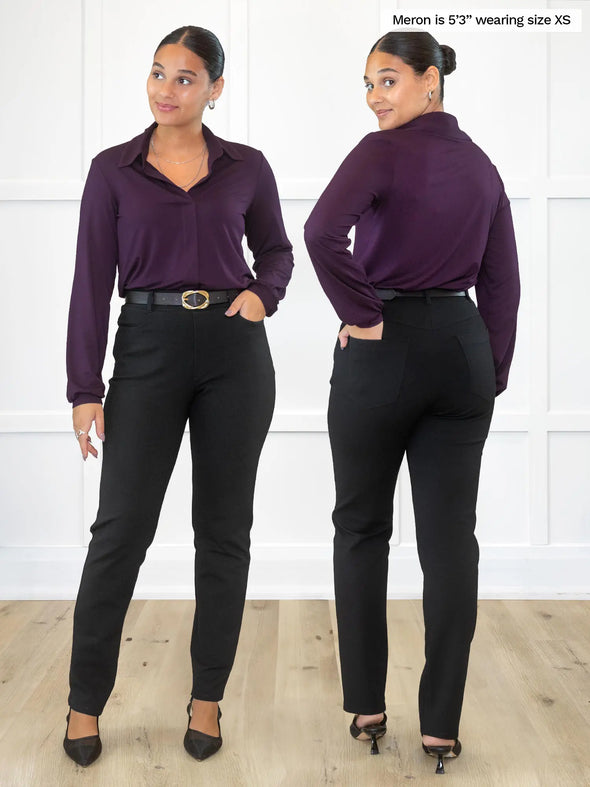 Miik model Meron (5'3", xsmall) wearing Miik's Uma mid-rise straight leg ponte pant with pockets in black with a collared shirt in port. Meron is showing the front and back of the pants #color_black