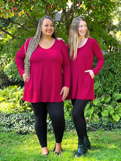 Miik models Sarita and Jo standing next to each other looking away both wearing the same outfit: Miik&