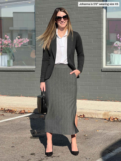 Woman smiling standing in a parking lot wearing Miik&