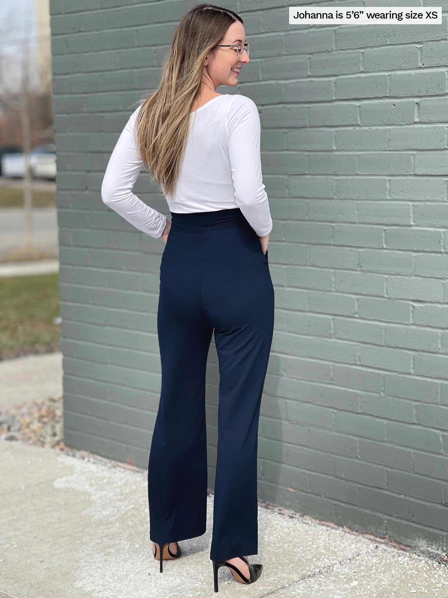 Woman standing with her back towards the camera showing the back of Miik&