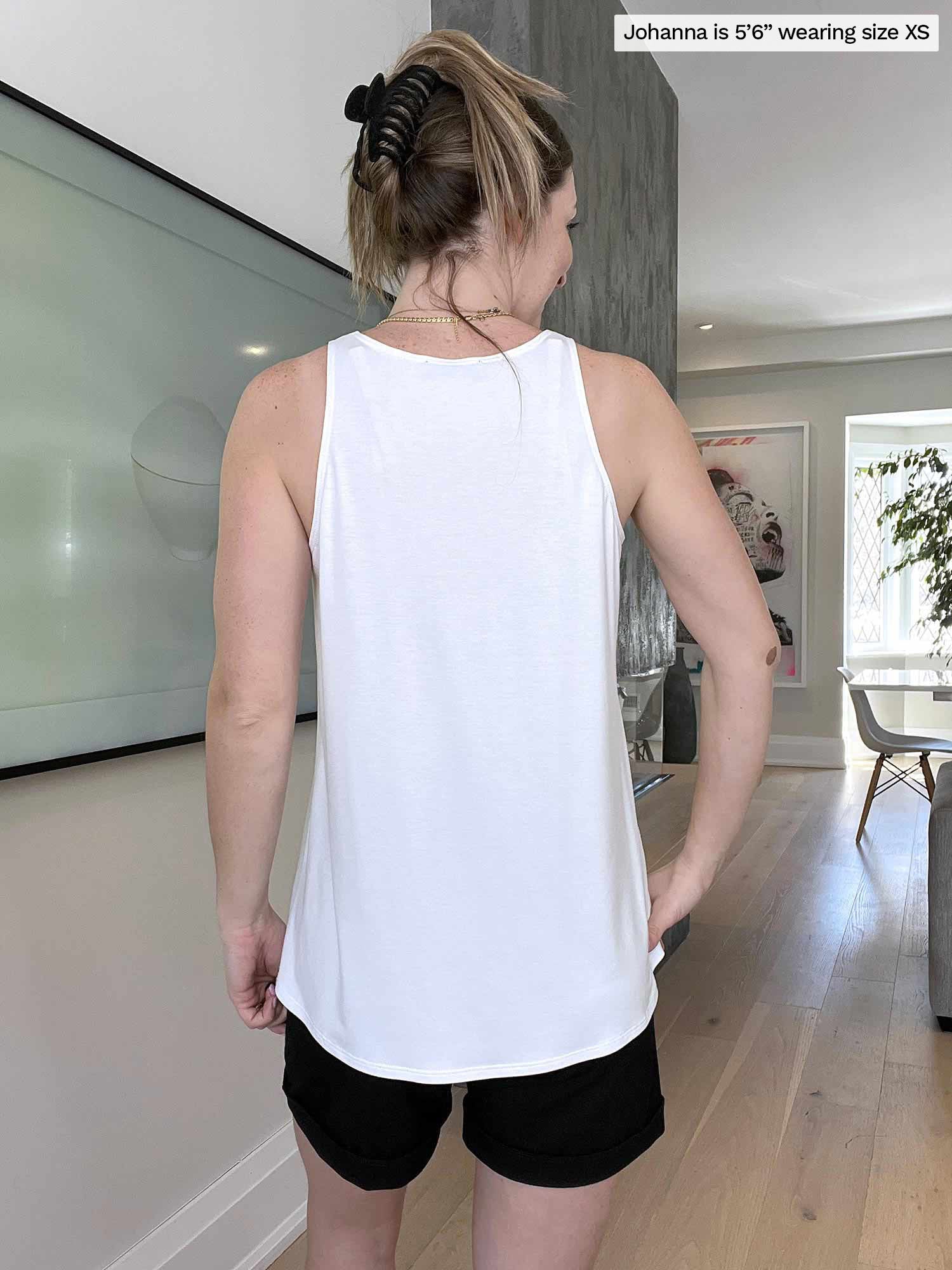 Miik model Johanna (five feet six, size extra small) standing with her back towards the camera showing the back of Miik&