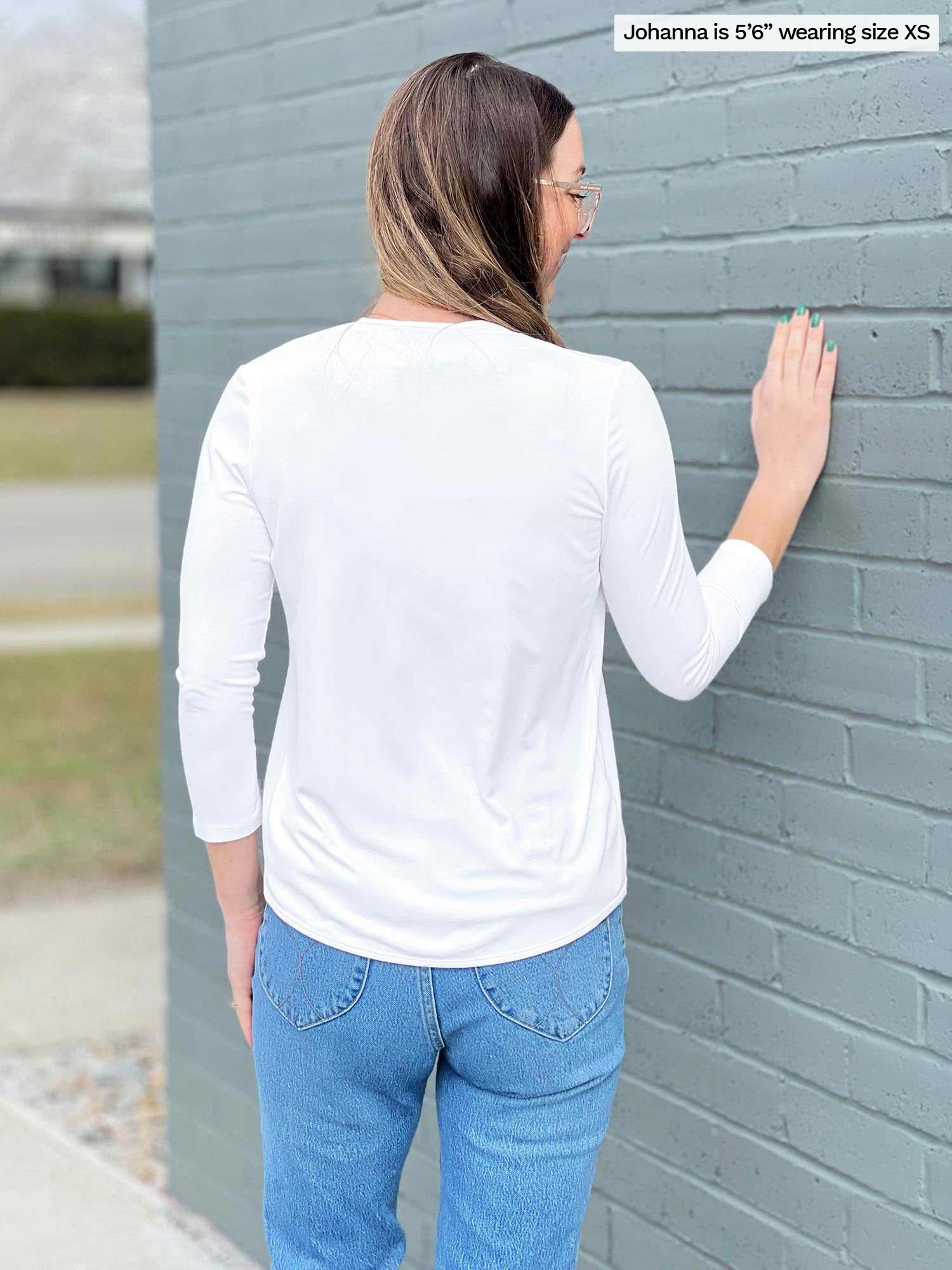 Woman standing with her back towards the camera showing the back of Miik&